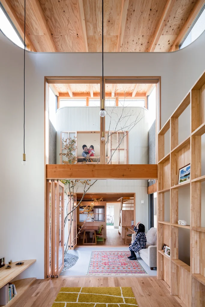Open-plan living and dining area with timber flooring and natural light.