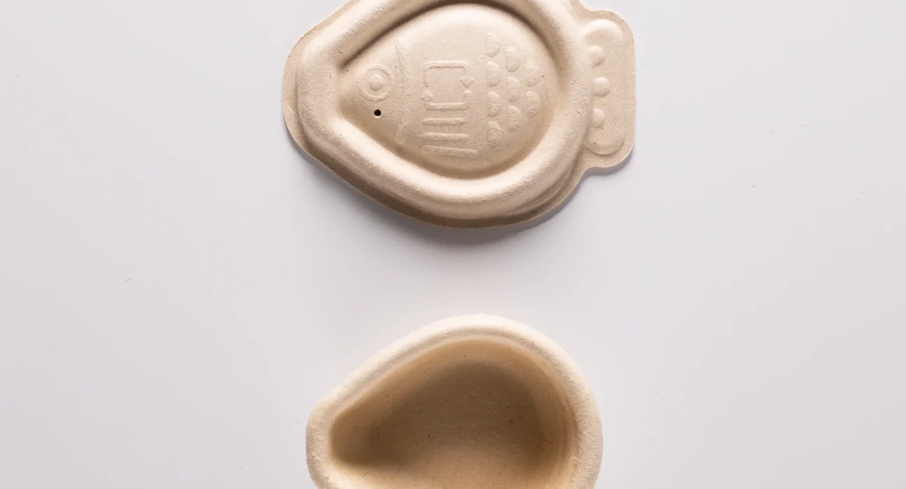 Compostable soy sauce fish designed to replace traditional single-use plastic containers