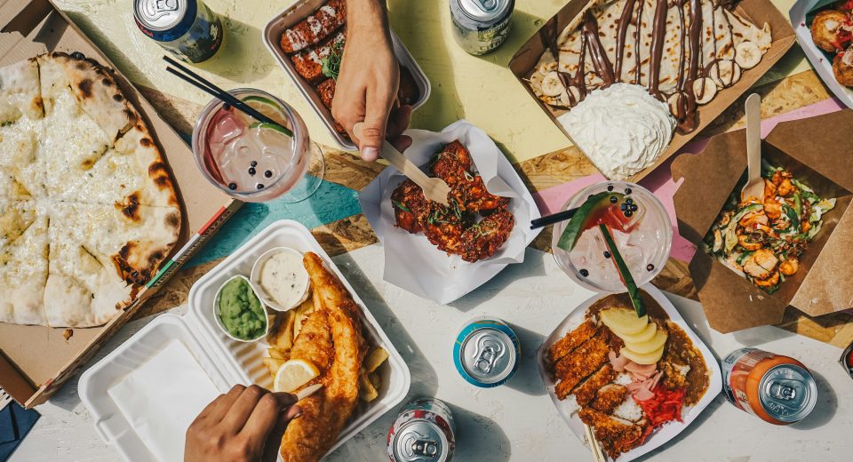Mixed selection of delivered meals placed on a table
