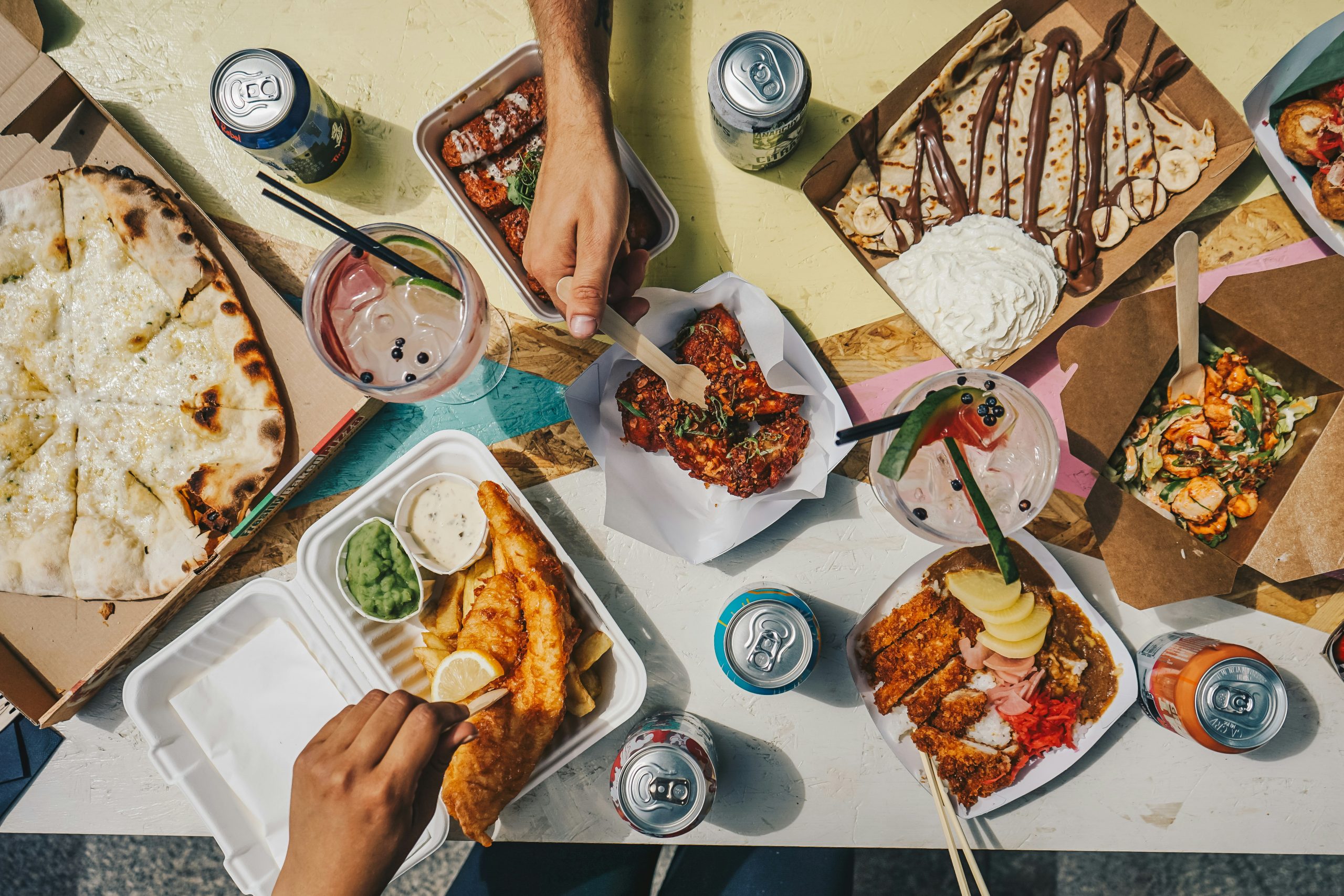 Mixed selection of delivered meals placed on a table